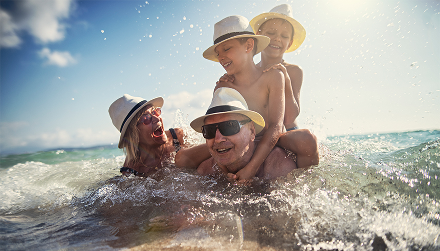 Grandparents playing with grandsons